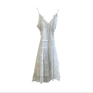 White spaghetti strap cotton dress with tulle bottom.